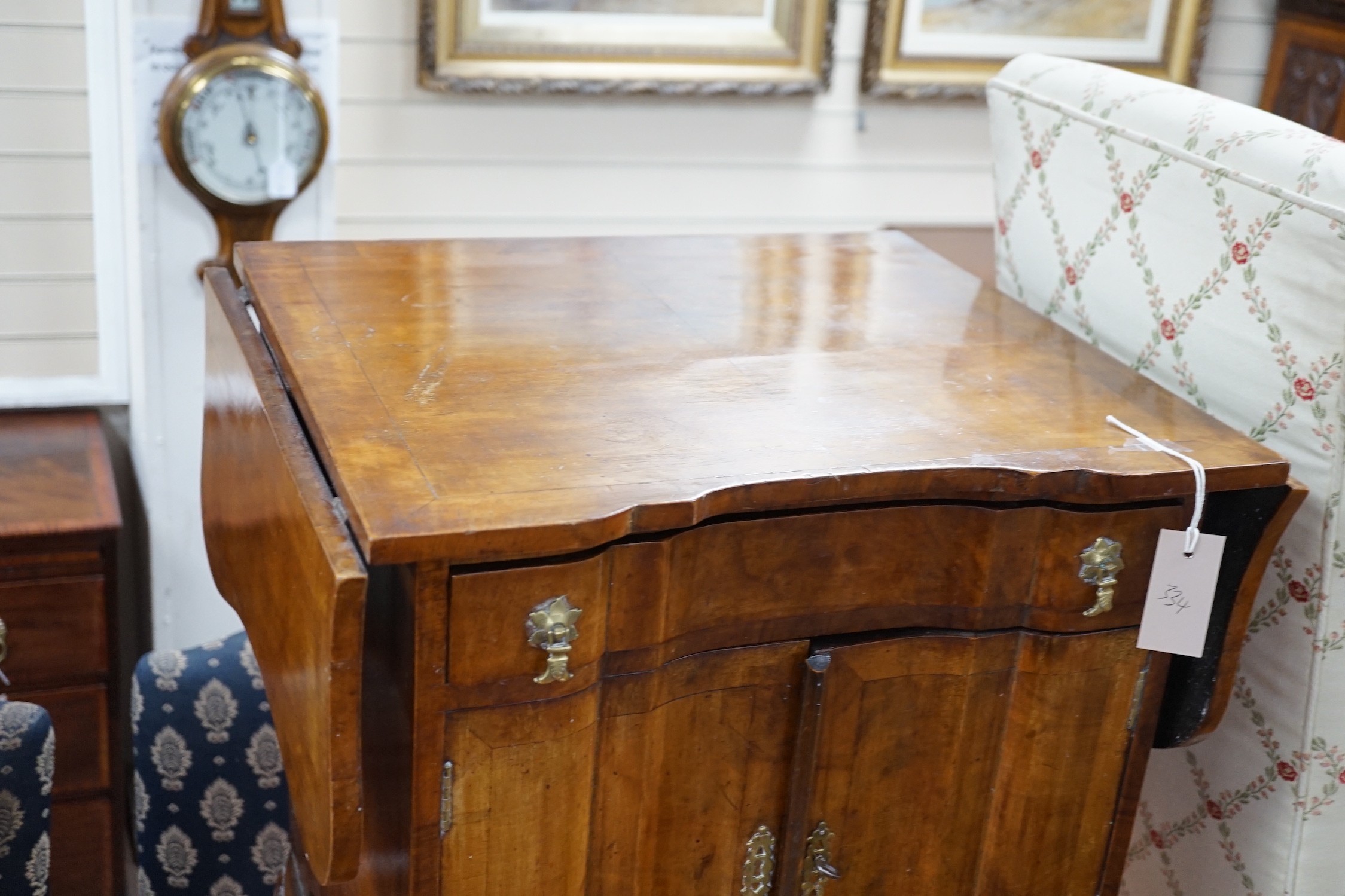 A 1930's walnut bedside cabinet, width 55cm *Please note the sale commences at 9am.